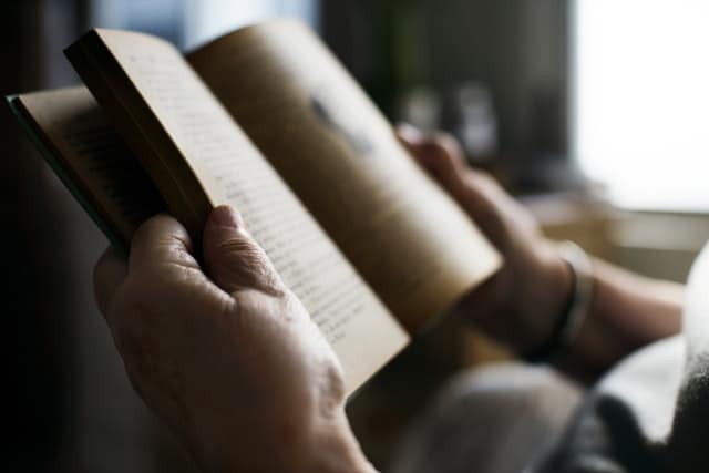 person reading, relaxing, destressing