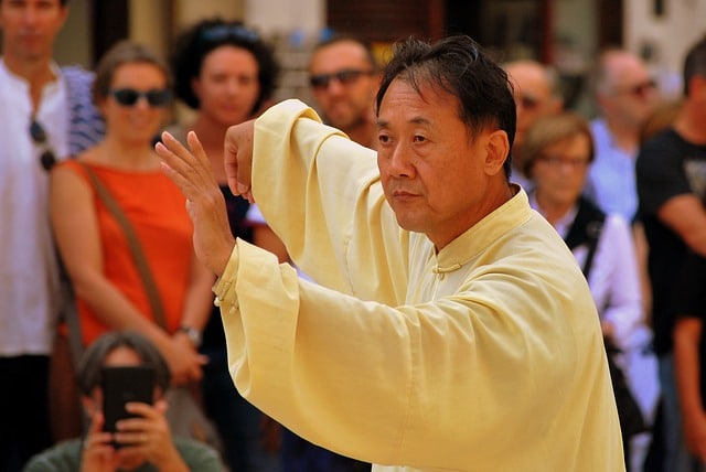 Asian man performing tai chi