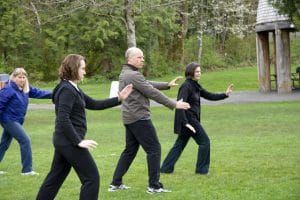 seniors performing qigong on World Tai chi and Qigong Day