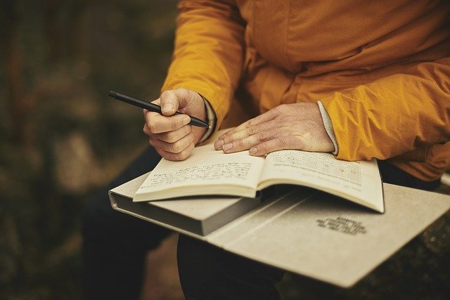 older woman writing 