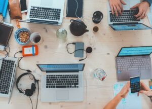 aerial view image of a workspace with laptops 