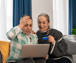 older adults on computer after fraud 