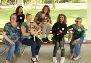 group of friends life care staff and members at yappy hour event