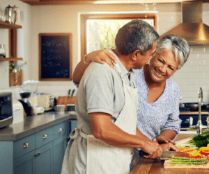 couple cooking healthy in kitchen people of color 
