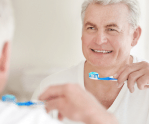 bathroom accessibility for seniors baby boomer man brushing teeth