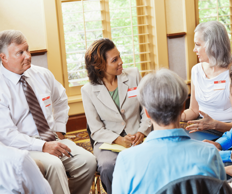 people sitting in a circle support group