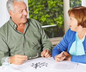 older couple doing a crossword puzzle