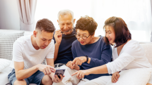 senior couple interacting with adult children asian