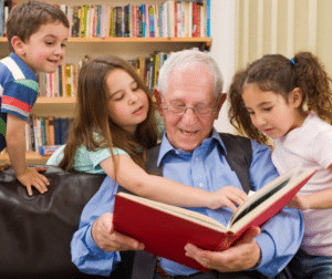 grandpa telling stories to children