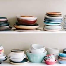 shelf cluttered with dishes