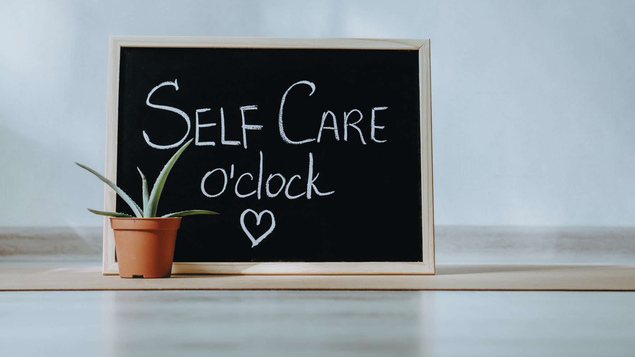 self care oclock written on chalk board