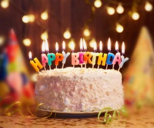 birthday cake with a lot of lighted candles